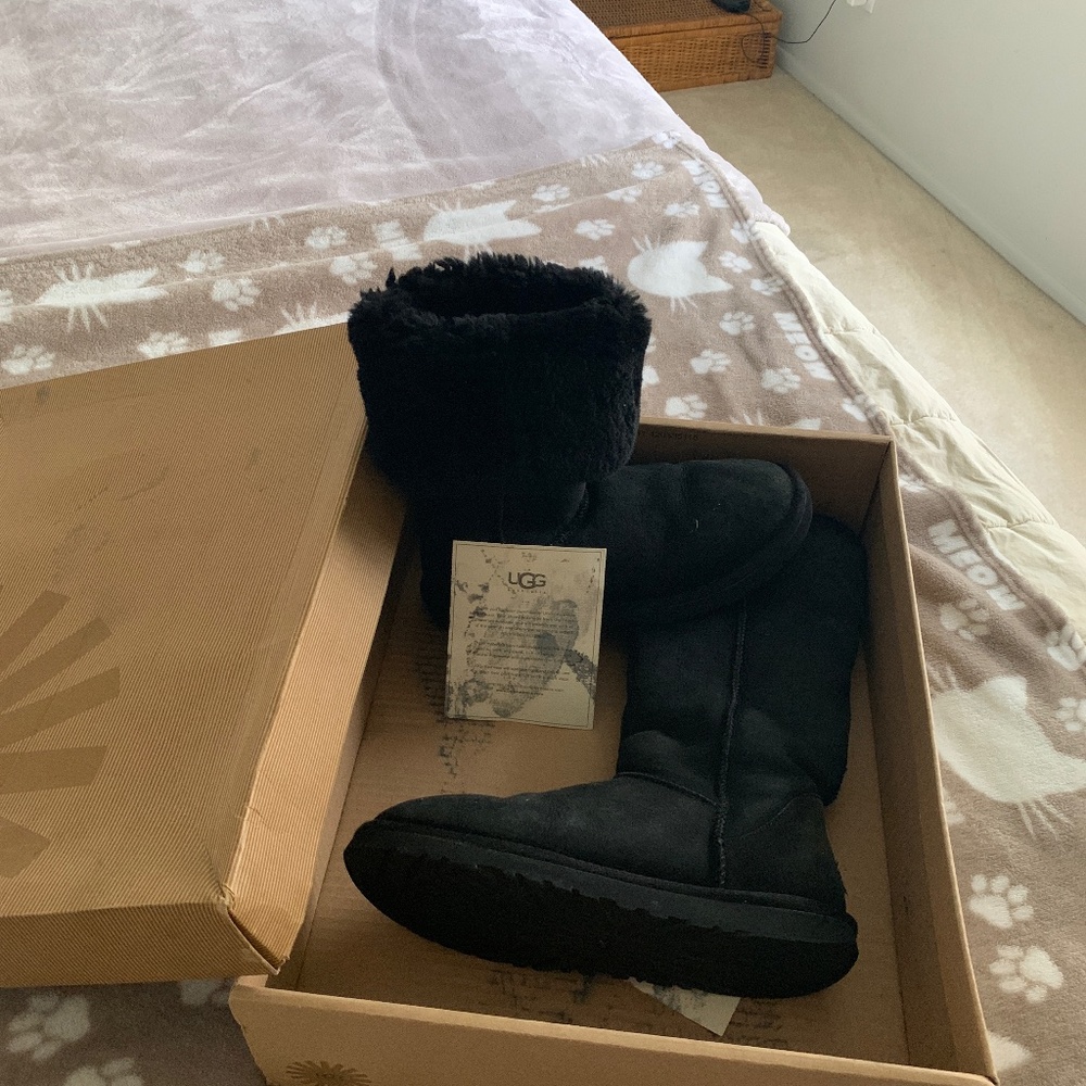 Tall black UGG boots
